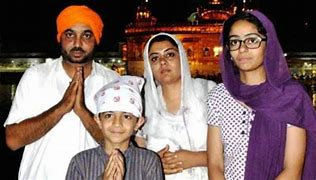 Bhagwat Mann with his ex-wife and children